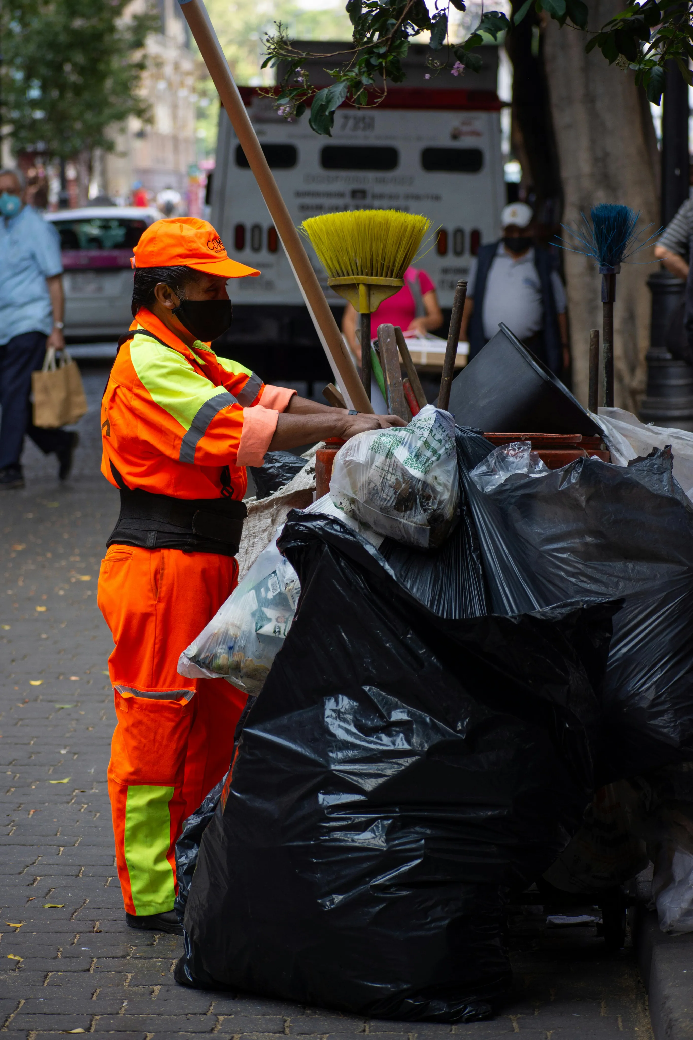 Residents and sanitation workers engaging with waste management services