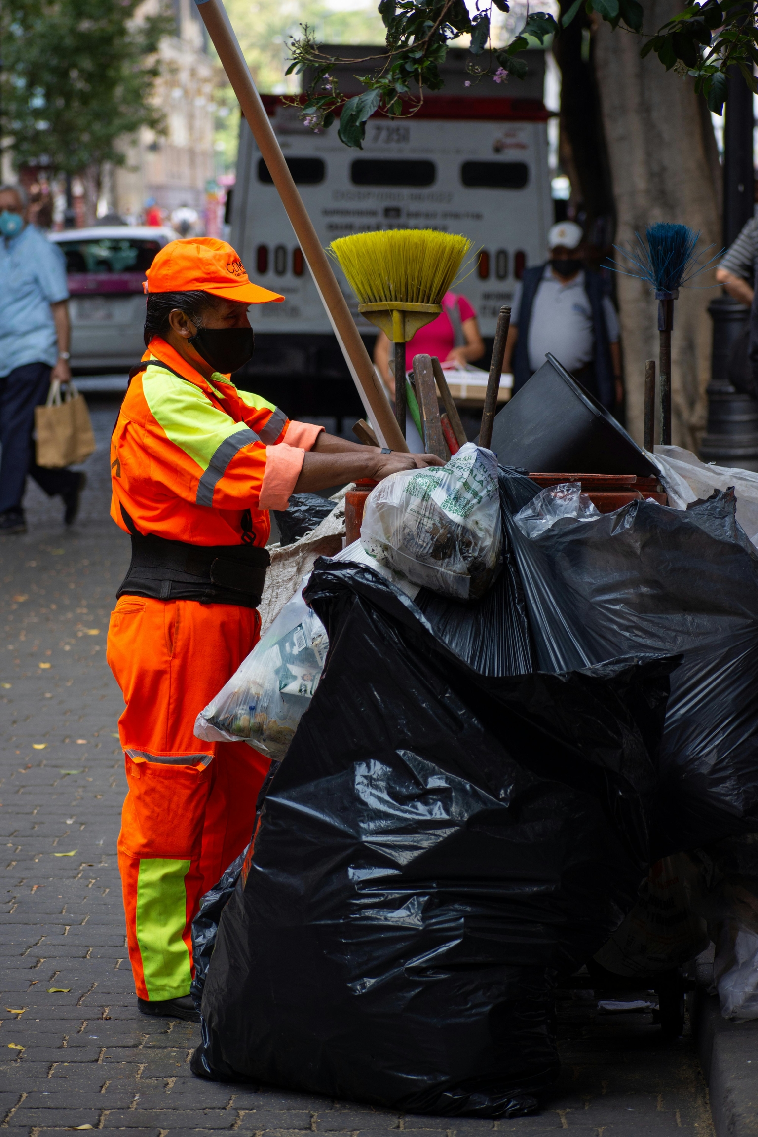 Residents and sanitation workers engaging with waste management services